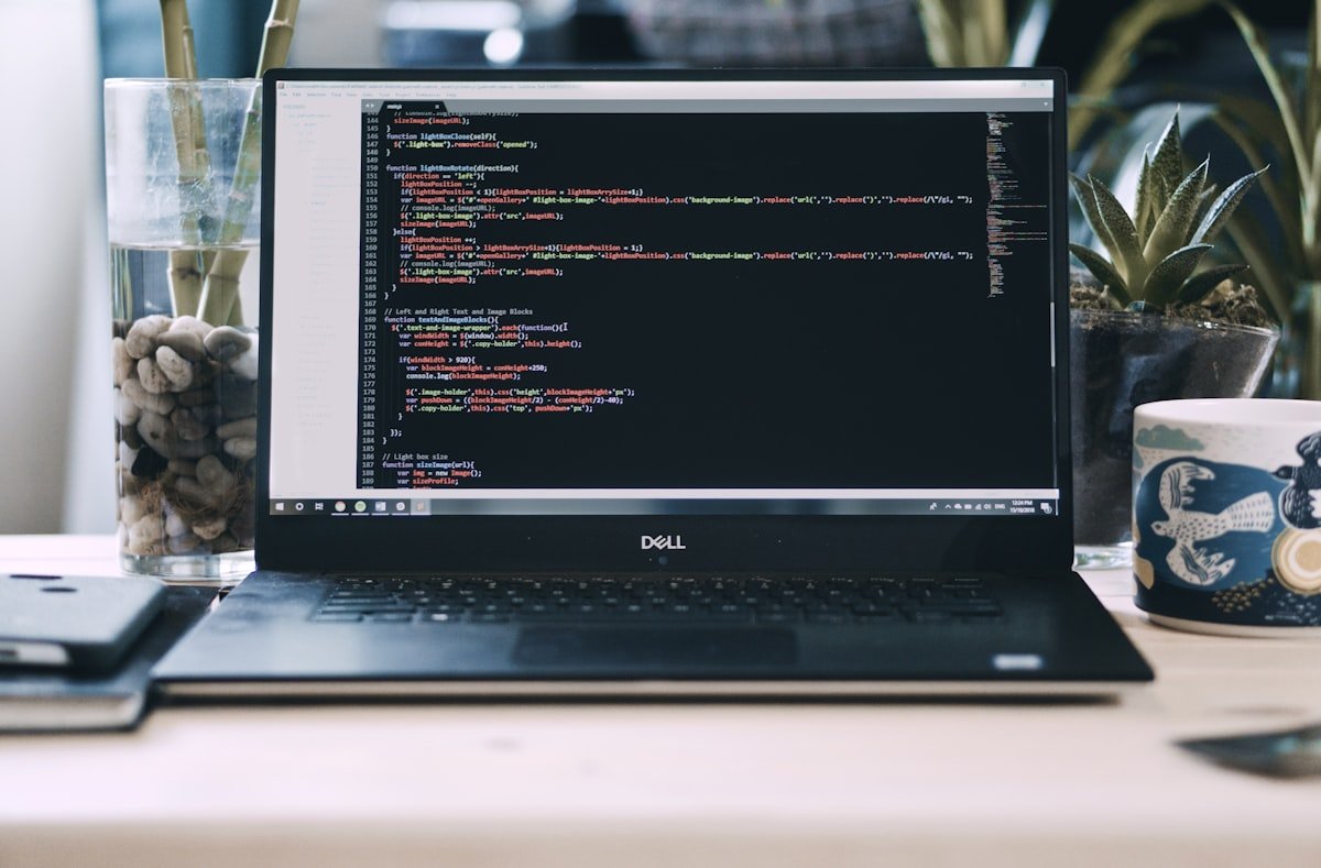 Laptop on a desk used for compressing PDF files online